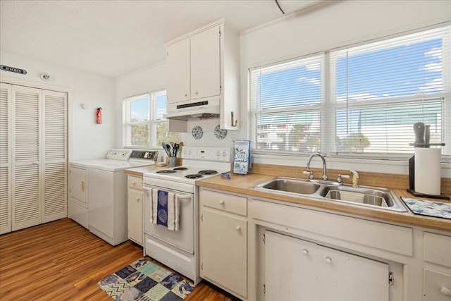 kitchen featuring white electric range, separate washer and dryer, sink, white cabinets, and light wood-type flooring