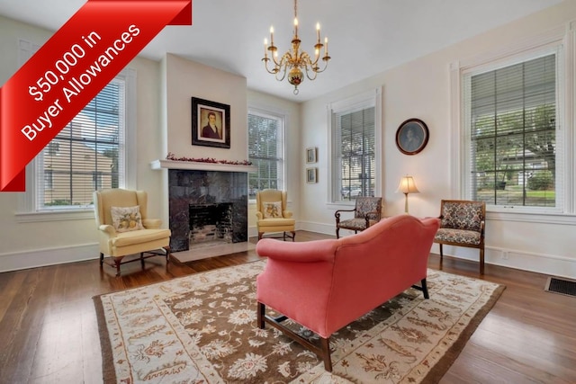 410 N Calhoun St, Tallahassee, FL 32301 - living area featuring a premium fireplace, a chandelier, and wood finished floors