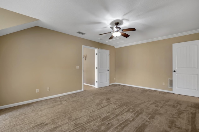 empty room with carpet, baseboards, visible vents, and ceiling fan