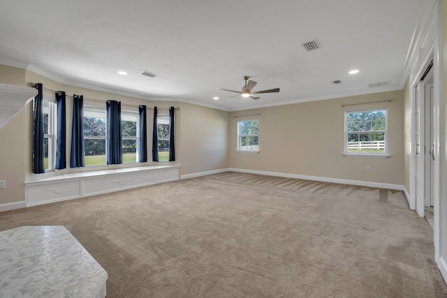 unfurnished room with light carpet, ornamental molding, and visible vents