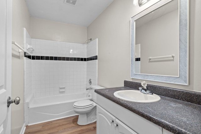 1552 China Grove Trl, Tallahassee, FL 32301 - full bath with wood finished floors, toilet, vanity, and shower / washtub combination