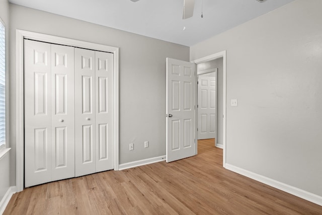 1552 China Grove Trl, Tallahassee, FL 32301 - unfurnished bedroom featuring light wood-style floors, baseboards, a closet, and a ceiling fan