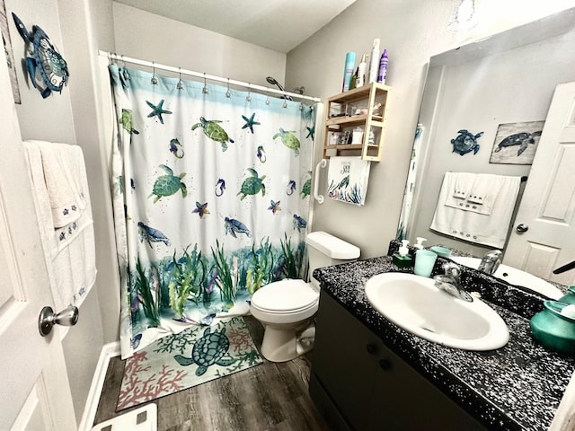 bathroom featuring hardwood / wood-style floors, vanity, and toilet