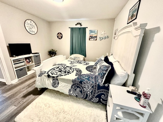 bedroom featuring wood-type flooring