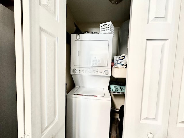 laundry room featuring stacked washer and dryer