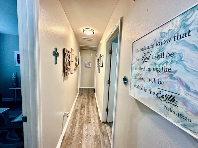 corridor featuring light wood-type flooring