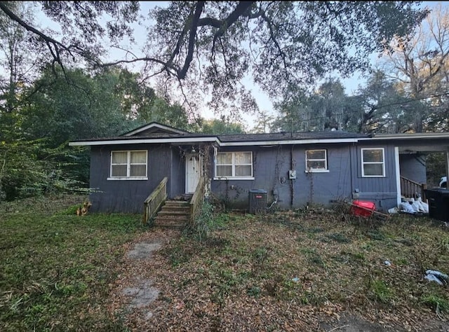 ranch-style house featuring central air condition unit