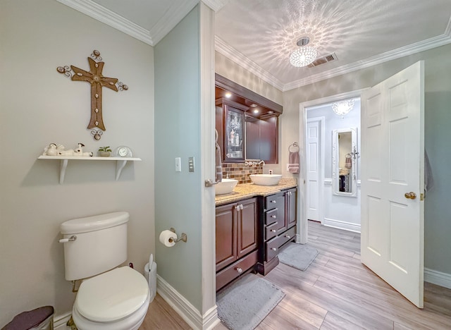 2825 Turkey Hill Trl, Tallahassee, FL 32312 - bathroom with tasteful backsplash, wood finished floors, vanity, baseboards, and visible vents