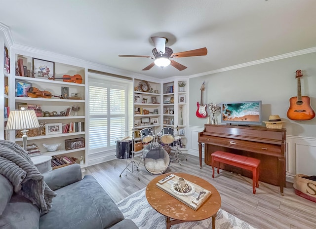 2825 Turkey Hill Trl, Tallahassee, FL 32312 - sitting room featuring a ceiling fan, built in features, light wood-style flooring, and crown molding