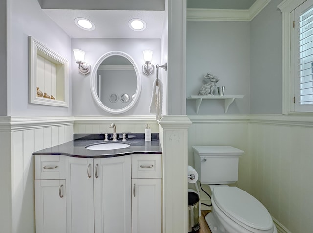 2825 Turkey Hill Trl, Tallahassee, FL 32312 - bathroom with crown molding, wainscoting, toilet, a decorative wall, and vanity