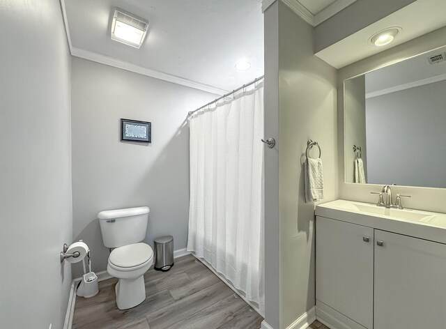 2825 Turkey Hill Trl, Tallahassee, FL 32312 - bathroom with curtained shower, wood finished floors, toilet, ornamental molding, and baseboards