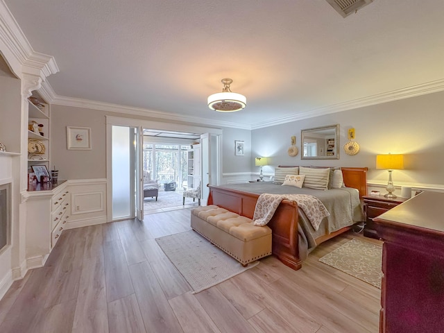 2825 Turkey Hill Trl, Tallahassee, FL 32312 - bedroom with a fireplace, crown molding, access to exterior, and light wood-style floors