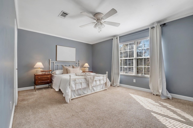 bedroom featuring crown molding, ceiling fan, and light carpet