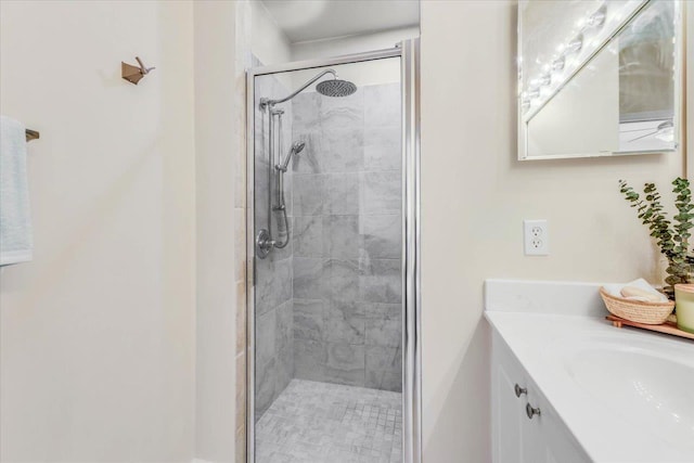 full bath with a shower stall and vanity