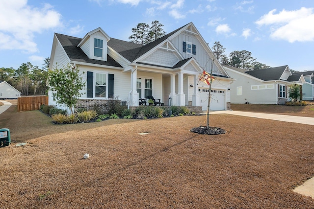 view of front of property with a garage and covered porch