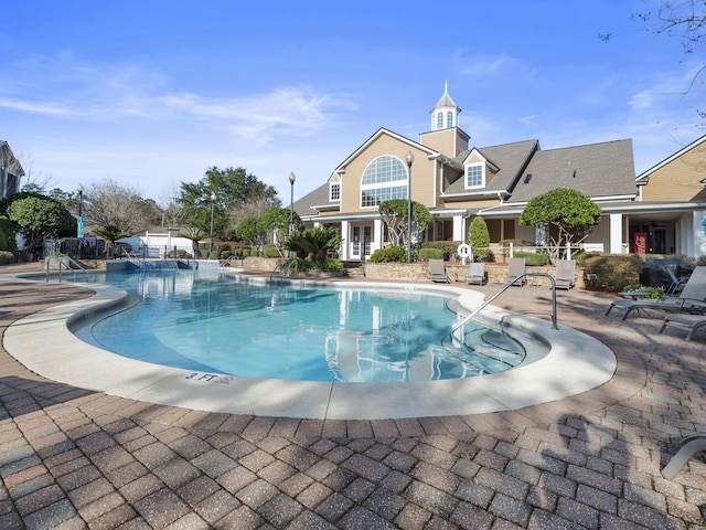 view of pool featuring a patio area