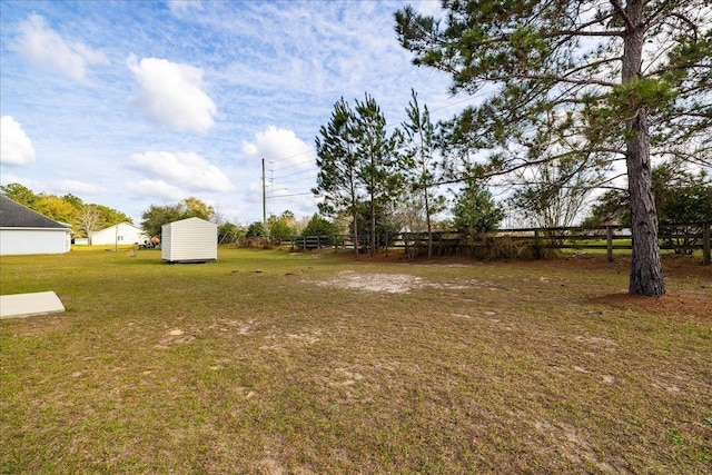 489 Charles Willis Dr, Midway, FL 32343 - view of yard featuring a storage unit and an outbuilding