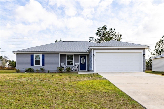 489 Charles Willis Dr, Midway, FL 32343 - ranch-style house with a porch, an attached garage, driveway, and a front lawn