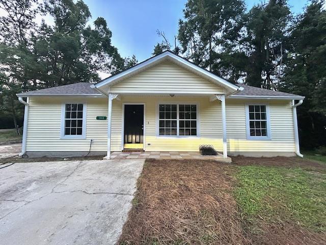 1445 Idlewild Dr, Tallahassee, FL 32311 - view of front of property with covered porch and roof with shingles