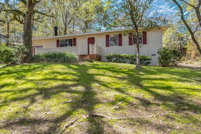 ranch-style house with a front lawn