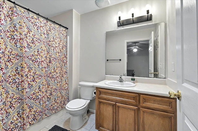 bathroom with a shower with curtain, vanity, ceiling fan, tile patterned floors, and toilet