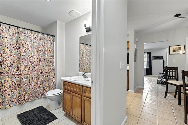 full bathroom with toilet, vanity, a shower with curtain, and tile patterned floors
