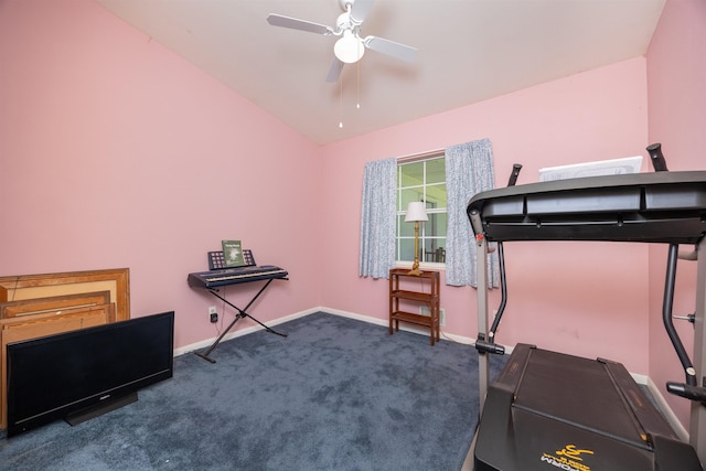 workout room featuring lofted ceiling, dark carpet, and ceiling fan