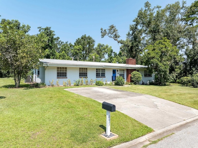 ranch-style home with a front yard and central air condition unit