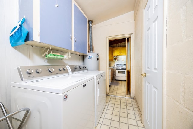 washroom with cabinets, independent washer and dryer, and water heater