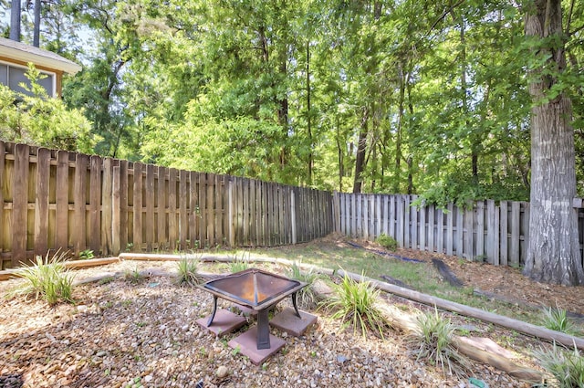 8504 Hannary Cir, Tallahassee, FL 32312 - view of yard with a fenced backyard and a fire pit