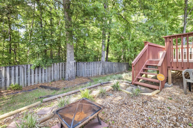 8504 Hannary Cir, Tallahassee, FL 32312 - view of yard with fence, stairs, an outdoor fire pit, and a wooden deck