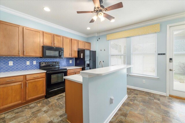 kitchen with decorative backsplash, an island with sink, ornamental molding, and black appliances