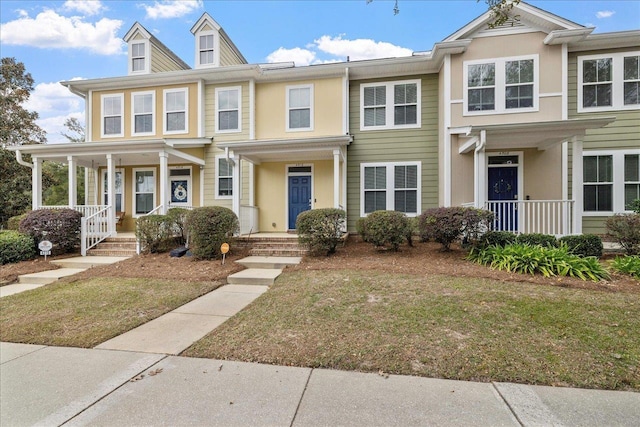 townhome / multi-family property with covered porch