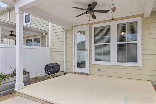 doorway to property featuring a patio and ceiling fan