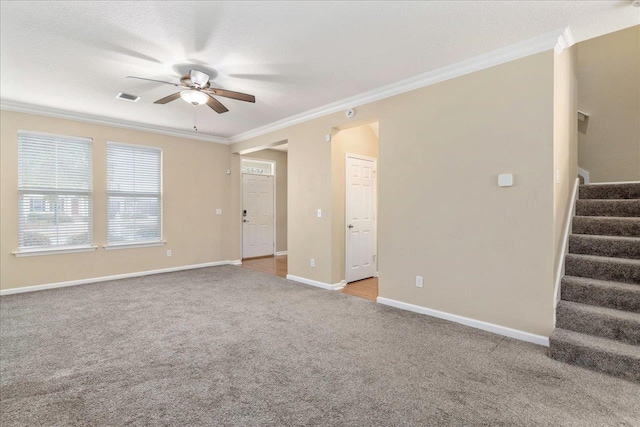 empty room with light carpet, ceiling fan, and ornamental molding