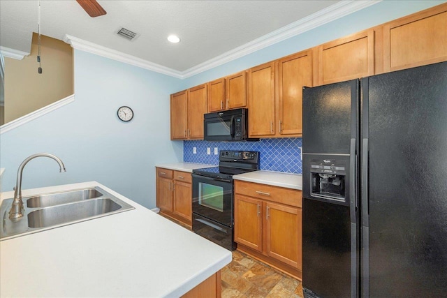 kitchen with black appliances, decorative backsplash, crown molding, and sink