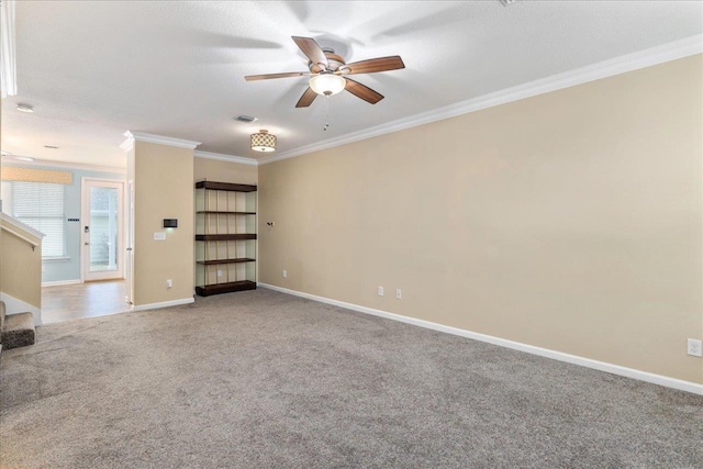 unfurnished living room with carpet flooring, ceiling fan, and crown molding