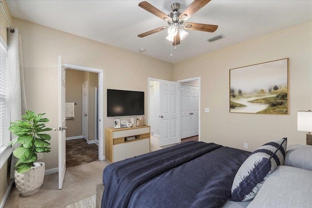 carpeted bedroom with ceiling fan