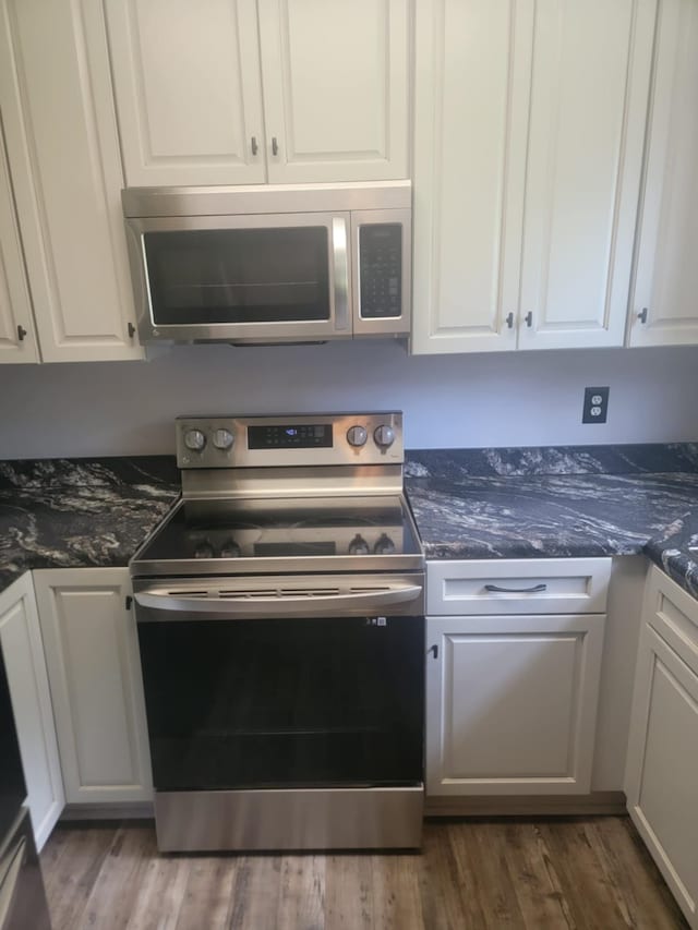 kitchen with white cabinetry and stainless steel appliances