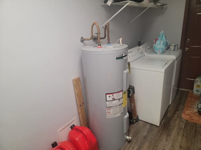 laundry room featuring electric water heater, washer and clothes dryer, and dark hardwood / wood-style floors