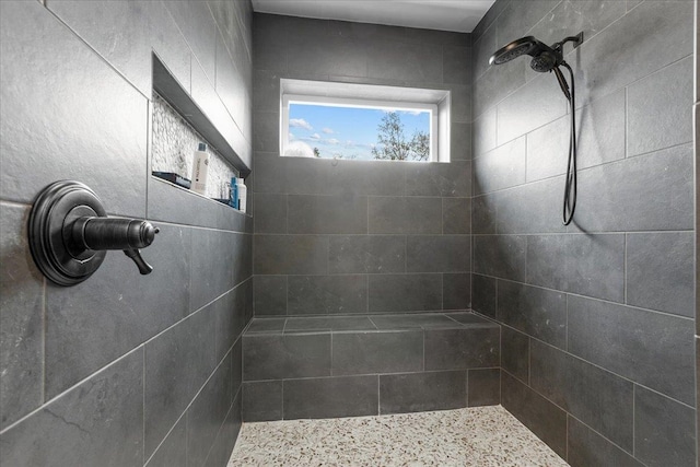 bathroom featuring a tile shower