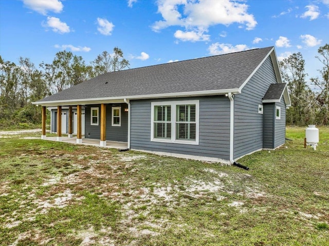 exterior space featuring a patio and a front lawn