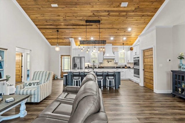 living room featuring high vaulted ceiling, crown molding, dark hardwood / wood-style floors, a notable chandelier, and wood ceiling