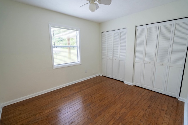 6611 Crooked Creek Rd, Tallahassee, FL 32311 - unfurnished bedroom with multiple closets, wood-type flooring, and a ceiling fan