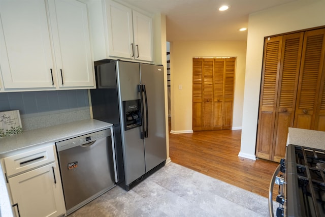 6611 Crooked Creek Rd, Tallahassee, FL 32311 - kitchen featuring stainless steel appliances, light countertops, white cabinets, backsplash, and recessed lighting