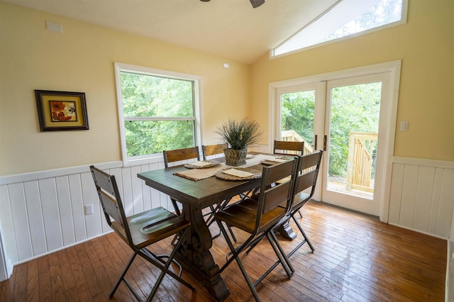 6611 Crooked Creek Rd, Tallahassee, FL 32311 - dining room with a wainscoted wall, hardwood / wood-style flooring, vaulted ceiling, a ceiling fan, and a decorative wall