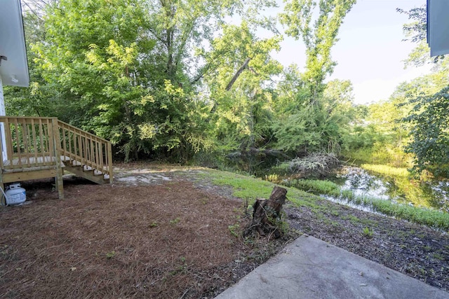 6611 Crooked Creek Rd, Tallahassee, FL 32311 - view of yard with stairs and a wooden deck