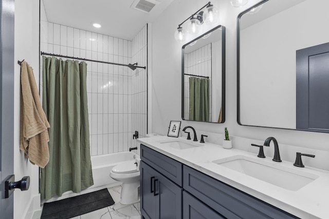 full bathroom featuring vanity, toilet, and shower / tub combo with curtain