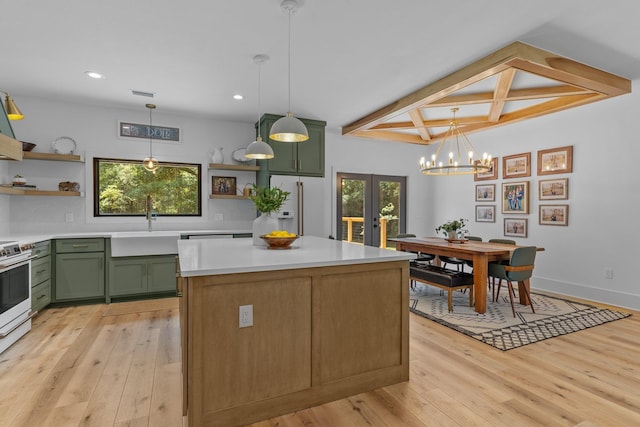 kitchen featuring beamed ceiling, sink, green cabinets, light hardwood / wood-style flooring, and coffered ceiling