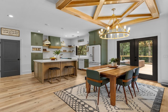 dining space featuring french doors, light wood-type flooring, coffered ceiling, a chandelier, and beamed ceiling